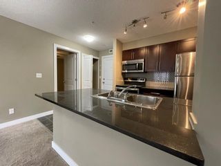 Photo 3: 9309 403 Mackenzie Way SW: Airdrie Apartment for sale : MLS®# A2023384