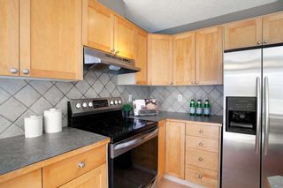 Photo 9: 92 Rocky Vista Circle NW in Calgary: Rocky Ridge Row/Townhouse for sale : MLS®# A2079391