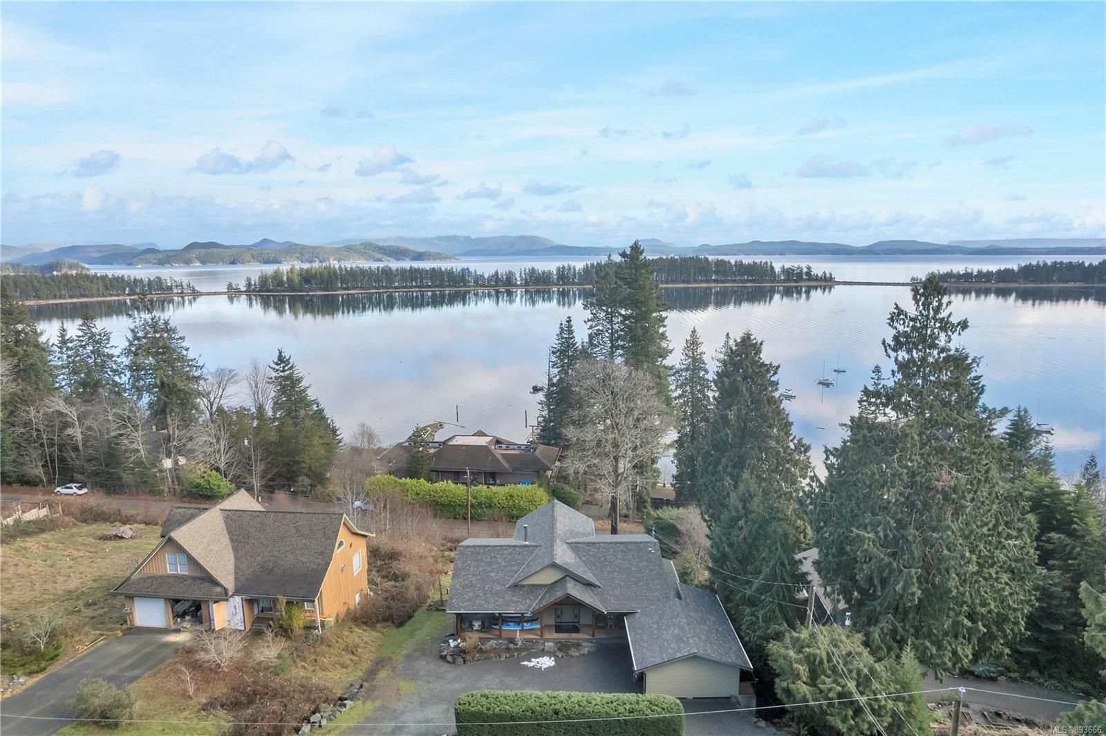 Heriot Bay custom built ocean view home featuring panoramic views across Drew Harbour to Rebecca Spit Provincial Park!