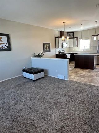 Photo 2: 191 Lynx Road N: Lethbridge Row/Townhouse for sale : MLS®# A2131369