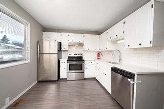 Photo 1: 8402 Berkley Road NW in Calgary: Beddington Heights Semi Detached (Half Duplex) for sale : MLS®# A2009701