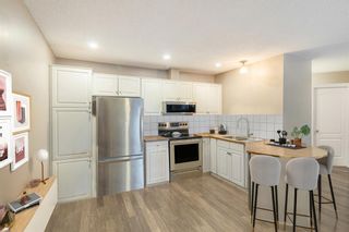 Photo 2: 209 10 Sierra Morena Mews SW in Calgary: Signal Hill Apartment for sale : MLS®# A2030849