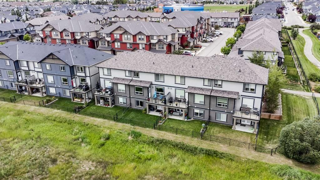 Welcome to this Walk-out Townhome Backing onto the Environmental Reserve in the Great Community of Williamstown in Airdrie.