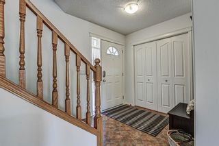 Photo 3: 28 Cougarstone Square SW in Calgary: Cougar Ridge Detached for sale : MLS®# A1099416