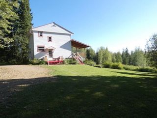 Main Photo: 7555 MILE 304 FRONTAGE Road in Fort Nelson: Fort Nelson -Town House for sale : MLS®# R2612150