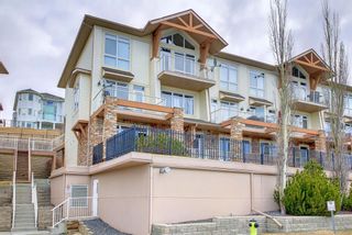 Photo 2: 14 140 Rockyledge View NW in Calgary: Rocky Ridge Row/Townhouse for sale : MLS®# A1199471