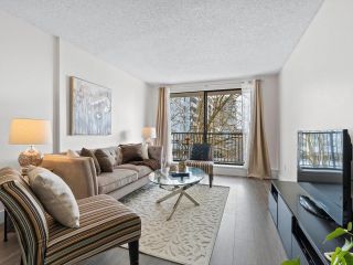 Photo 1: 207 150 E 15TH Street in North Vancouver: Central Lonsdale Condo for sale in "Lions Gate Plaza" : MLS®# R2691801