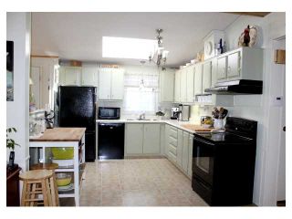 Photo 3: 97 145 KING EDWARD Street in Coquitlam: Maillardville Manufactured Home for sale in "MILL CREEK VILLAGE" : MLS®# V876573