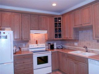Photo 4: 403 3280 PLATEAU Boulevard in Coquitlam: Westwood Plateau Condo for sale in "CAMELBACK" : MLS®# V1043547