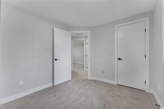 Photo 14: 12 Dovercliffe Way SE in Calgary: Dover Row/Townhouse for sale : MLS®# A2075357