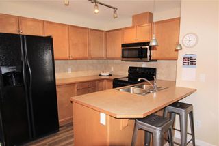 Photo 2: 2102 92 Crystal Shores Road: Okotoks Apartment for sale : MLS®# A1202214