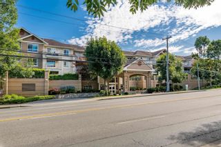 Photo 1: 214 19750 64TH Avenue in Langley: Willoughby Heights Condo for sale in "The Davenport" : MLS®# R2705486