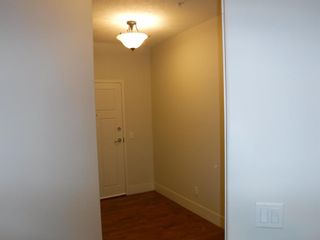Photo 2: 318 77 George Fox Trail: Cochrane Apartment for sale : MLS®# A1219994