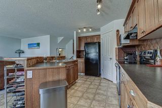 Photo 13: 28 Cougarstone Square SW in Calgary: Cougar Ridge Detached for sale : MLS®# A1099416
