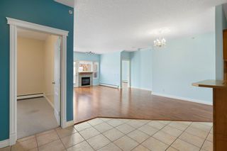 Photo 2: 319 248 Sunterra Ridge Place: Cochrane Apartment for sale : MLS®# A2004149