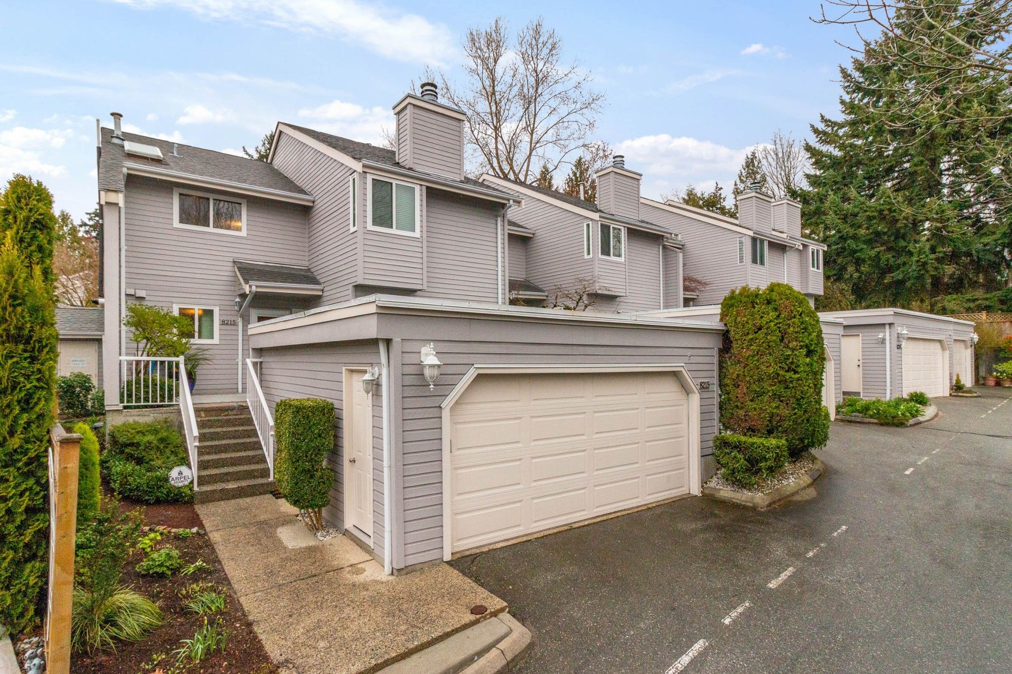 Main Photo: 8215 STRAUSS Drive in Vancouver: Champlain Heights Townhouse for sale in "Ashleigh Heights" (Vancouver East)  : MLS®# R2565596