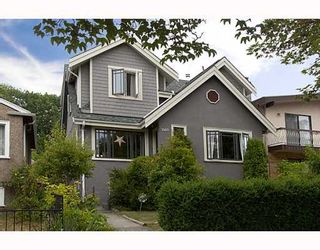 Photo 1: 2255 E 8TH Avenue in Vancouver: Grandview VE House for sale in "COMMERCIAL DRIVE" (Vancouver East)  : MLS®# V780371