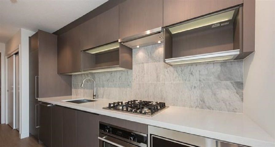 Linear kitchen with marble backsplash and gas range!