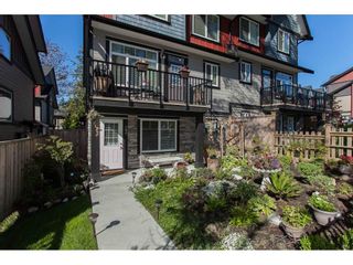 Photo 1: 23 6929 142 Street in Surrey: East Newton Townhouse for sale in "Redwood" : MLS®# R2110945
