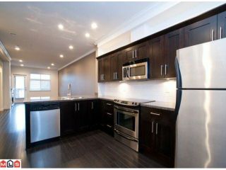 Photo 5: 14 15192 62A Avenue in Surrey: Sullivan Station Townhouse for sale in "ST. JAMES GATE" : MLS®# F1104157