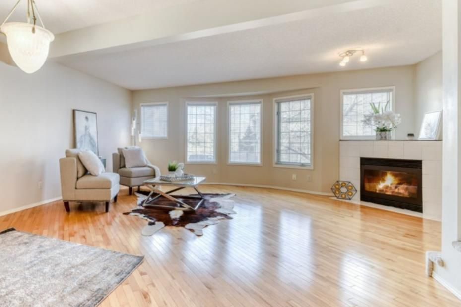 Beautiful living room with WOOD flooring and a cozy gas fireplace!!