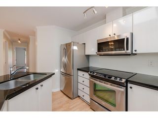 Photo 9: 405 150 W 22ND Street in North Vancouver: Central Lonsdale Condo for sale in "The Sierra" : MLS®# R2416817
