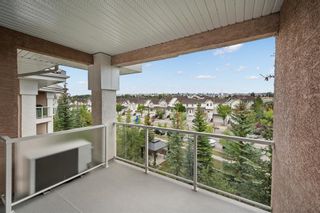 Photo 1: 383 223 Tuscany Springs Boulevard NW in Calgary: Tuscany Apartment for sale : MLS®# A2000799