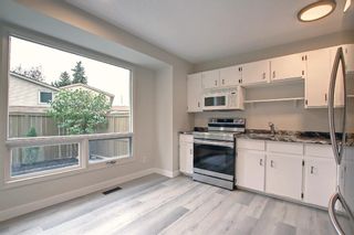 Photo 8: 77 123 Queensland Drive SE in Calgary: Queensland Row/Townhouse for sale : MLS®# A1145434