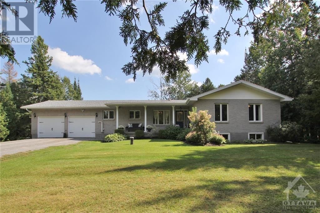 Beautiful mature gardens welcome you to this lovely bungalow!