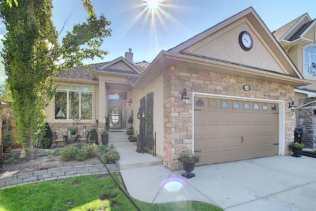 Main Photo: 31 Strathlea Common SW in Calgary: Strathcona Park Detached for sale : MLS®# A1147556