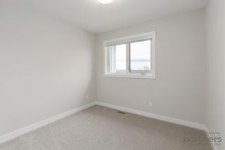 Photo 29: 948 Crestridge Common SW in Calgary: Crestmont Row/Townhouse for sale : MLS®# A2012906