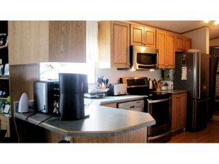 Photo 3: 112 145 KING EDWARD Street in Coquitlam: Maillardville Manufactured Home for sale in "MILL CREEK VILLAGE" : MLS®# V912443