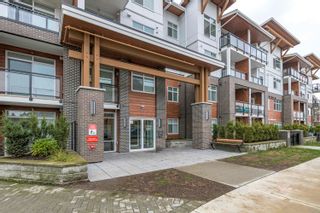 Photo 1: 124 5415 BRYDON Crescent in Langley: Langley City Condo for sale in "THE AUDLEY" : MLS®# R2748299