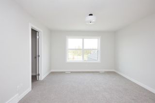 Photo 17: 823 Shawnee Terrace SW in Calgary: Shawnee Slopes Row/Townhouse for sale : MLS®# A2020368