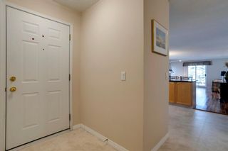 Photo 2: 1704 7171 Coach Hill Road SW in Calgary: Coach Hill Row/Townhouse for sale : MLS®# A1199169
