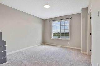 Photo 18: 225 Creekside Boulevard SW in Calgary: C-168 Semi Detached (Half Duplex) for sale : MLS®# A2062382