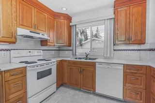 Photo 8: 911 104 Avenue SW in Calgary: Southwood Detached for sale : MLS®# A2054018