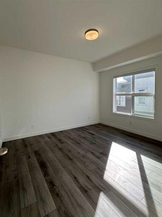 Photo 8: 128 Spring Creek Common SW in Calgary: Springbank Hill Row/Townhouse for sale : MLS®# A2109387