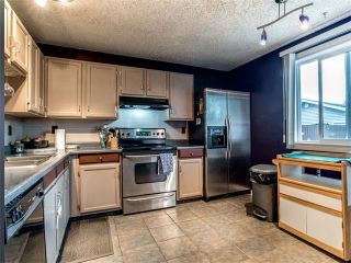Photo 7: 27 Woodmont Green SW in Calgary: Woodbine House for sale : MLS®# C4022488