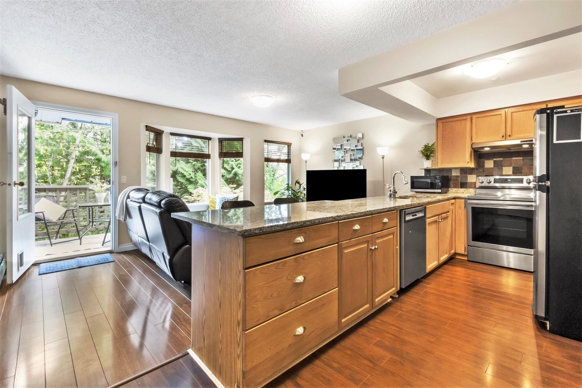 Photo 1: Photos: 8808 FINCH Court in Burnaby: Forest Hills BN Townhouse for sale (Burnaby North)  : MLS®# R2686440