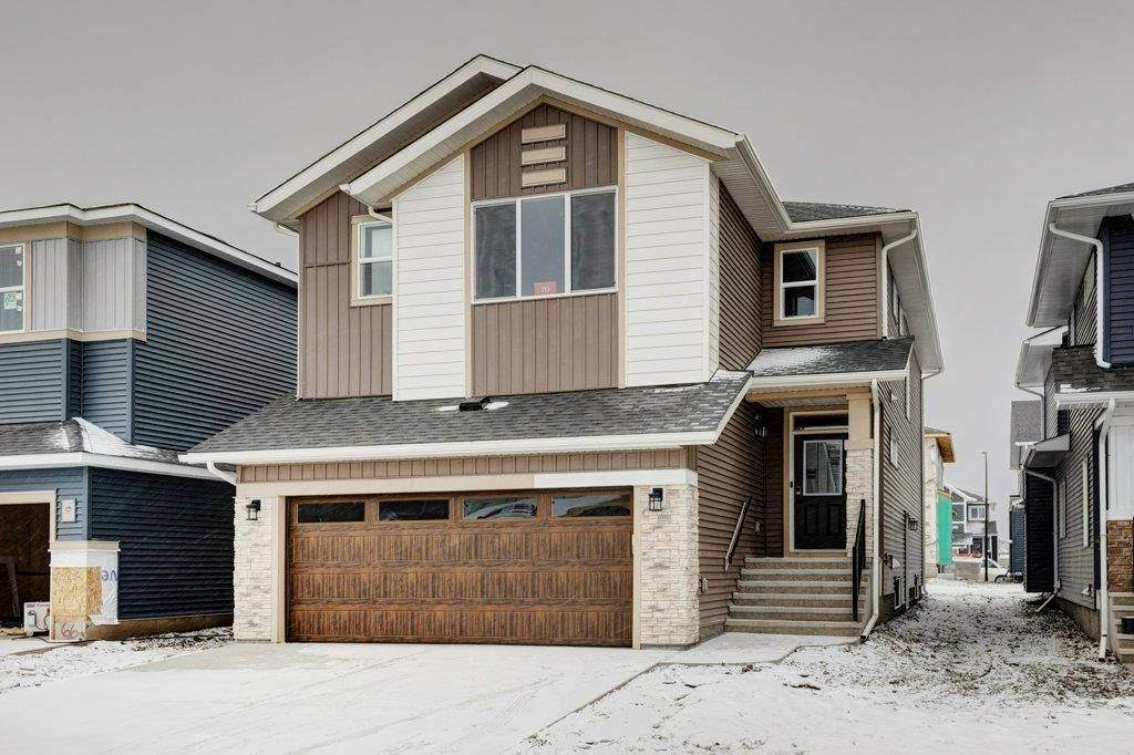 Main Photo: 70 Creekside Avenue SW in Calgary: C-168 Detached for sale : MLS®# A2014259