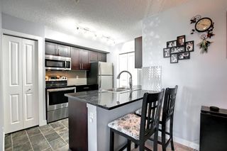 Photo 1: 6203 403 Mackenzie Way SW: Airdrie Apartment for sale : MLS®# A1256844
