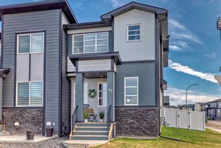 Photo 3: 99 Wolf Creek Avenue SE in Calgary: C-281 Row/Townhouse for sale : MLS®# A2130756