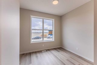 Photo 3: 212 Hotchkiss Drive in Calgary: C-385 Semi Detached (Half Duplex) for sale : MLS®# A2122668