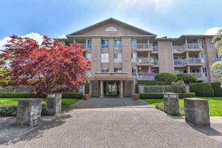 Photo 1: 210 13733 74 Avenue in Surrey: East Newton Condo for sale in "KINGS COURT" : MLS®# R2555646