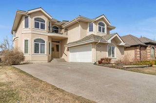 Main Photo: 1712 Evergreen Drive SW in Calgary: Evergreen Detached for sale : MLS®# A2126571