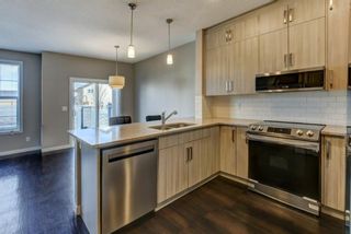 Photo 5: 105 881 Sage Valley Boulevard NW in Calgary: Sage Hill Row/Townhouse for sale : MLS®# A1214463