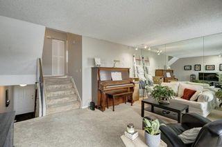 Photo 5: 143 Woodvale Bay SW in Calgary: Woodlands Row/Townhouse for sale : MLS®# A2022754