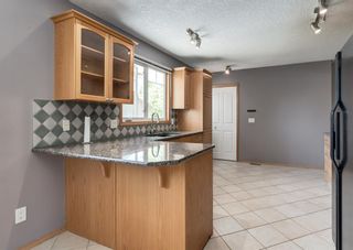 Photo 7: 128 Queensland Place SE in Calgary: Queensland Detached for sale : MLS®# A1224303