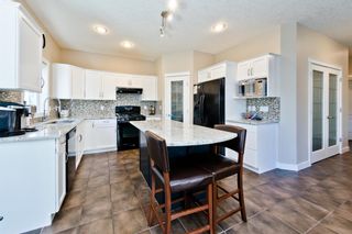 Photo 6: 125 COUGARSTONE Manor SW in Calgary: Cougar Ridge Detached for sale : MLS®# A1019561